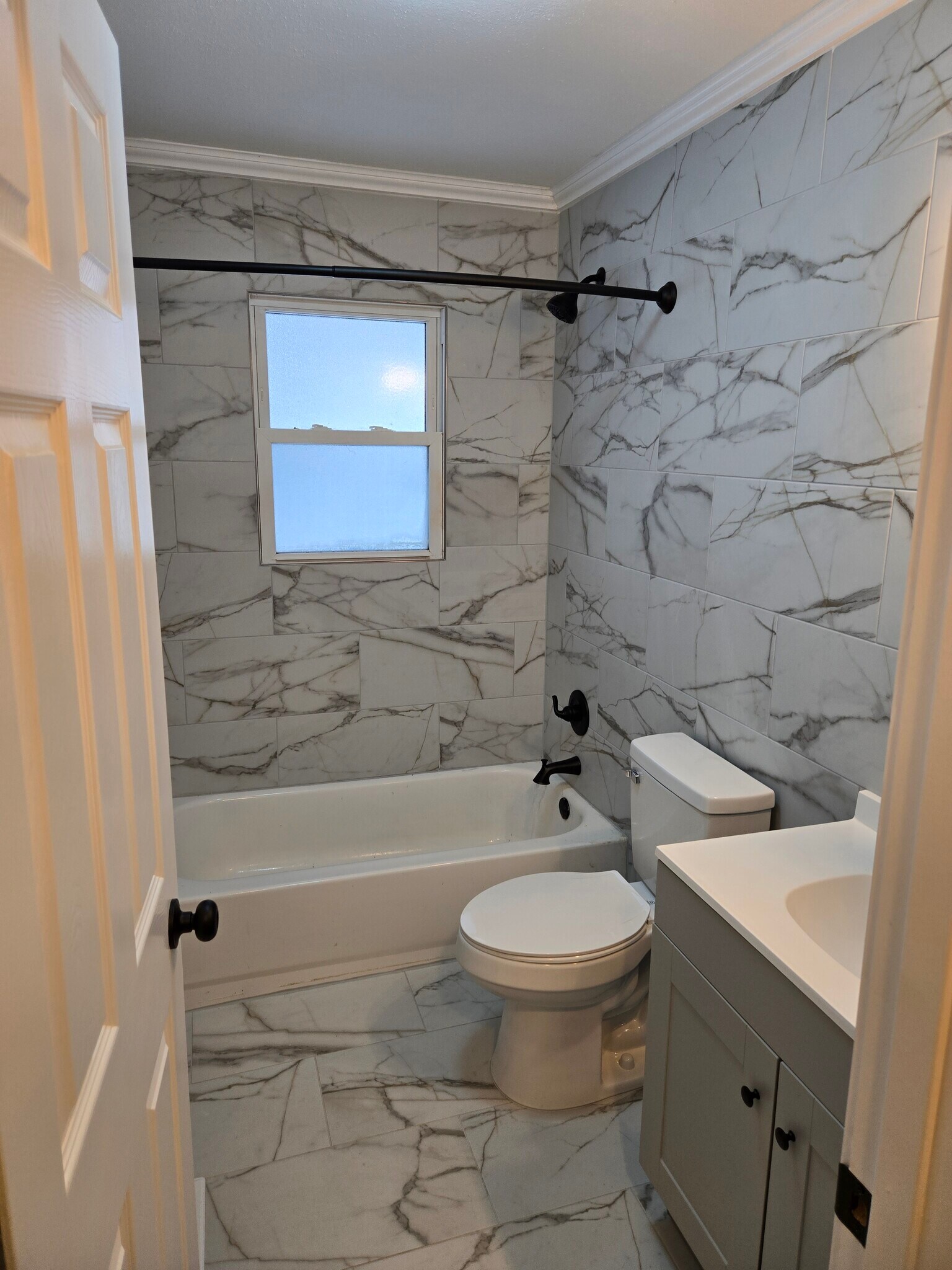 Floor to ceiling ceramic tile bath with crown molding - 807 S 15th St