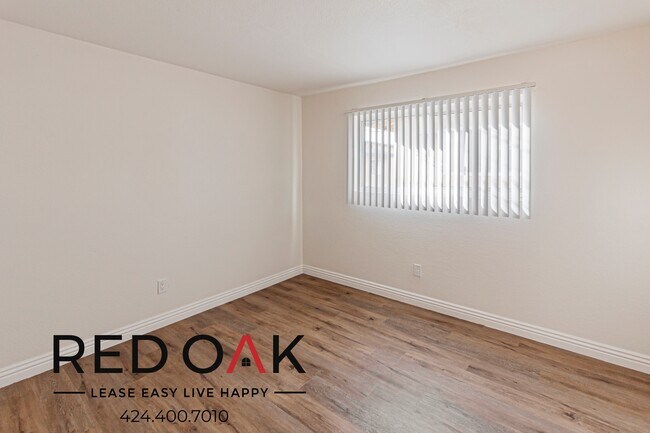 Building Photo - Spacious and Welcoming Two Bedroom with Lo...