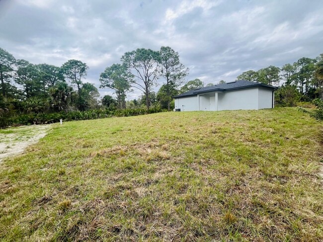 Building Photo - BRAND NEW CONSTRUCTION- ONE OF A KIND-ONE BEDROOM, ONE BATH-ONE CAR GARAGE- LEHIGH ACRES