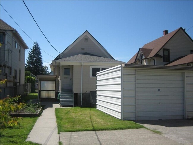 Building Photo - Charming 2BR Home with Spacious Yard, Detached Garage & Garden Oasis