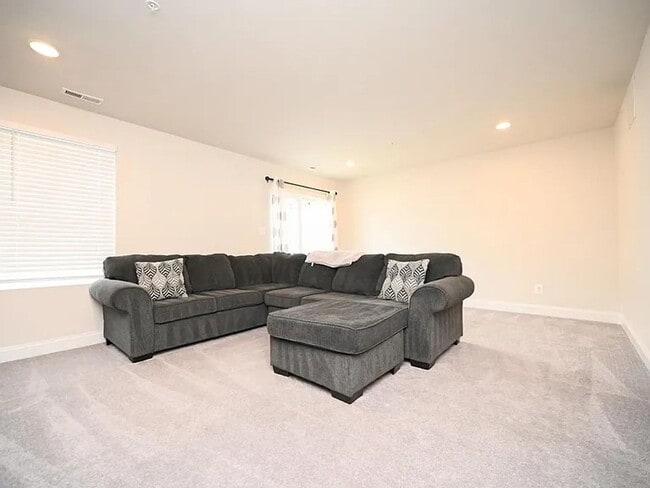 Building Photo - Stunning 3-Story Brick-Front Townhome | Modern Living + Military & First Responder Discount