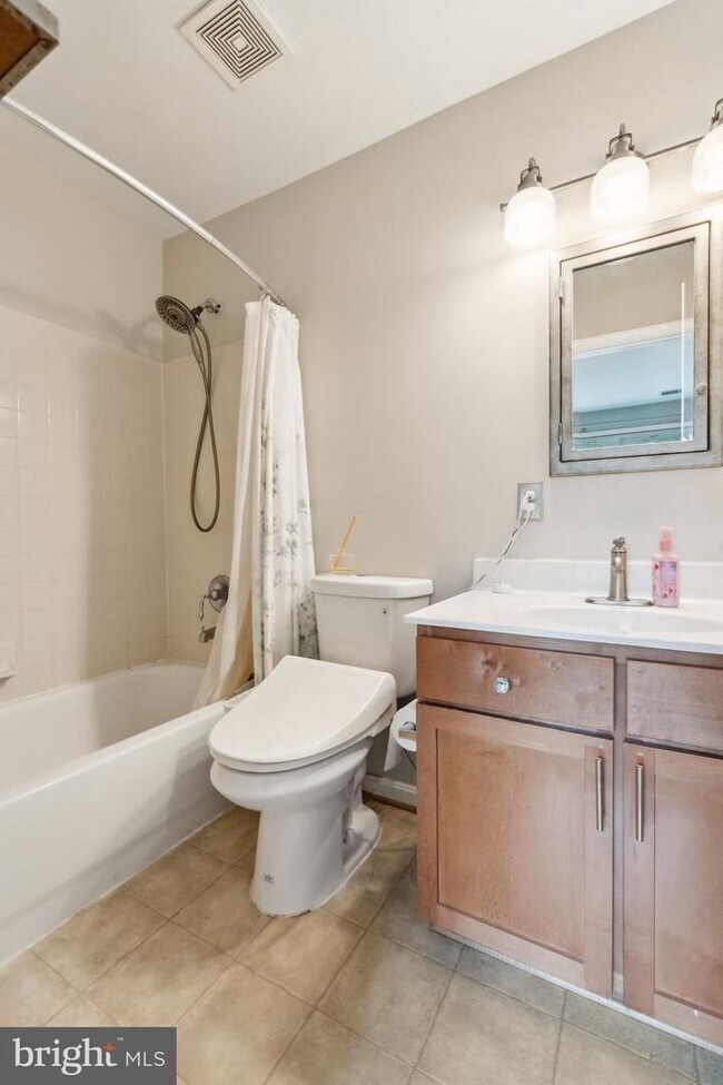 Building Photo - Welcome to this beautifully updated three ...