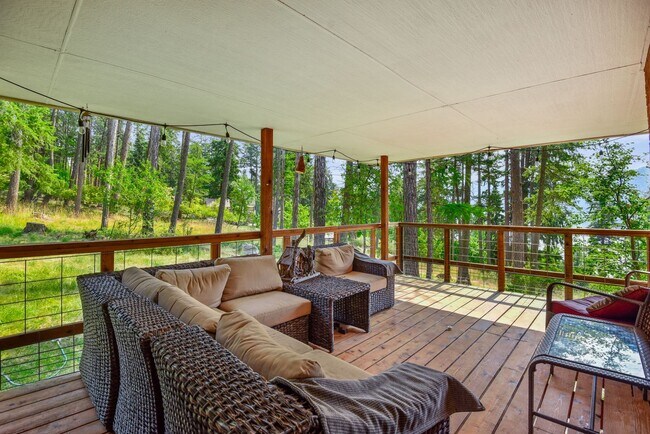 Building Photo - 2700 + sq ft family home has it all! Over 2 acres of land and a stunning view of Lake Pend Oreille