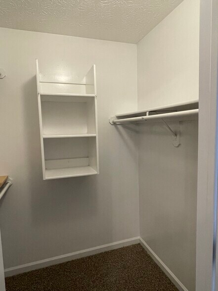 Primary walk-in closet - 10521 Cornell Ave