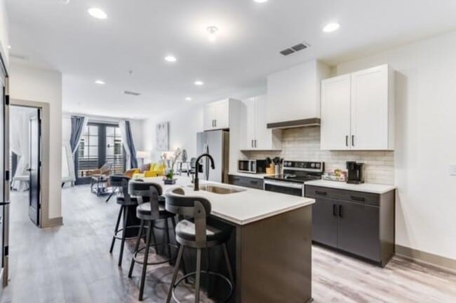 Building Photo - Modern Living Meets Walkable City Charm in...