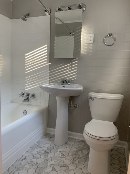 Upstairs hall bathroom with tub/shower - 166 Montague St