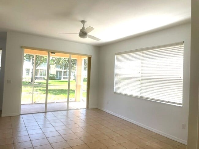Building Photo - Elegant 3 Bedroom End-Unit Condo with Screened Lanai & Pond Views and A Private Garage