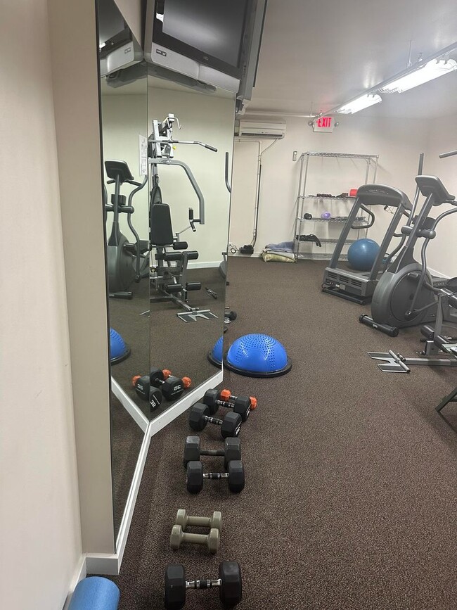 Building Photo - SAVE MONEY ON EXTENDED STAYS.  Beautiful Furnished and Completly Supplied Condo in Downtown Misso...
