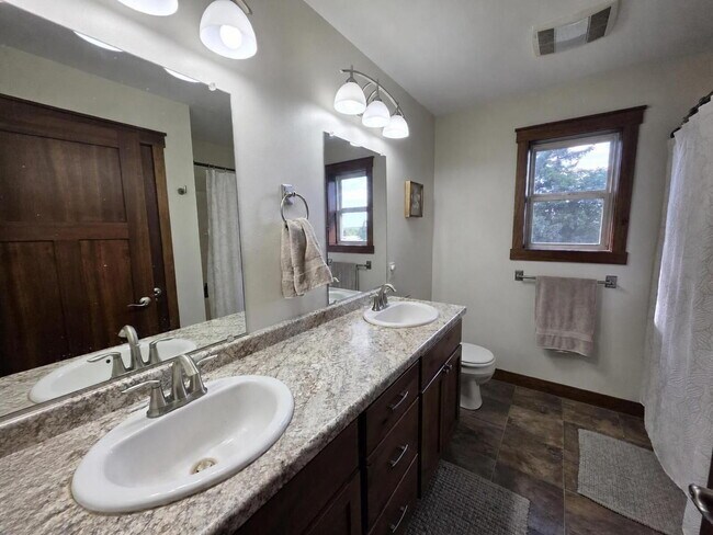 Building Photo - FREE SEPTEMBER RENT for this Spacious 4-Bedroom Home with Vaulted Ceilings with Finished Basement...