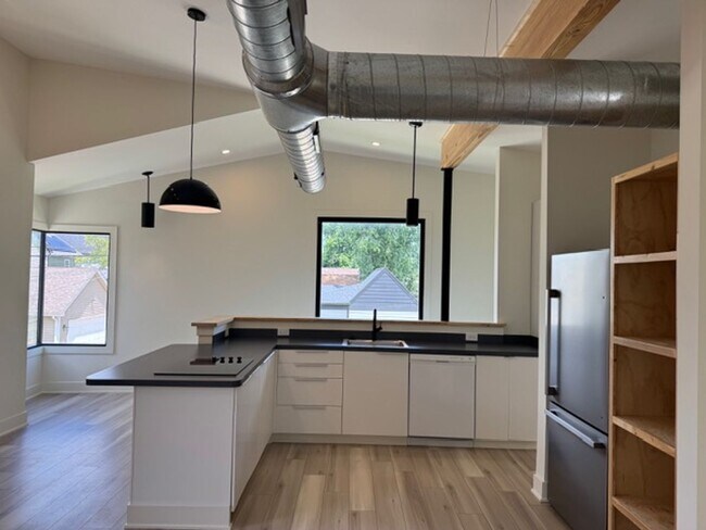 Building Photo - Vaulted Ceilings & Hardwood Floors in This Charming Indianapolis L