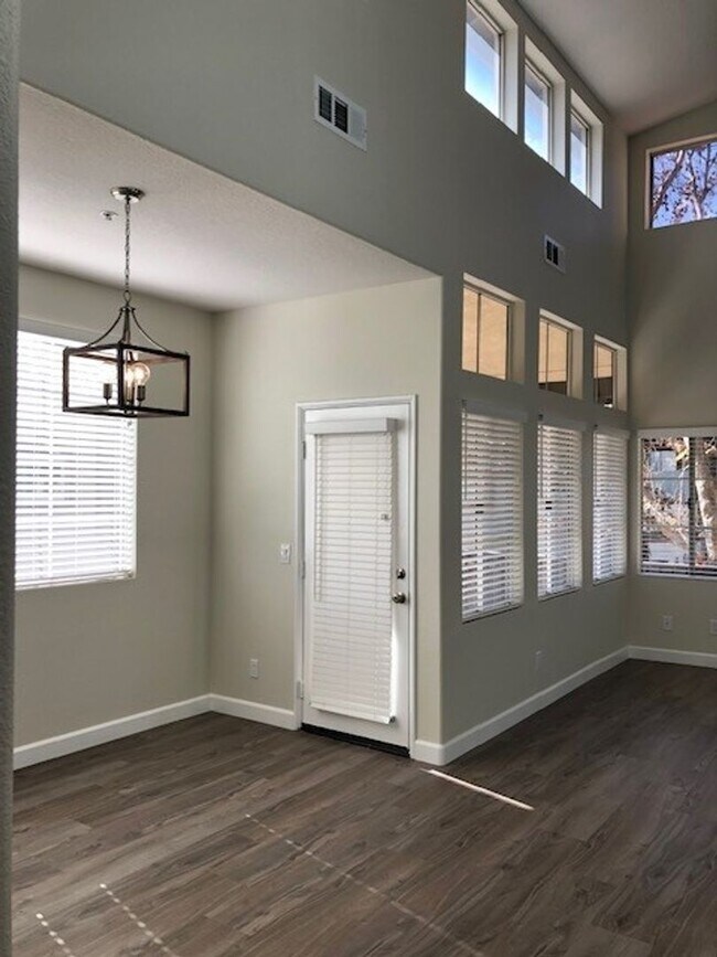 Building Photo - PICTURE PERFECT 2 BR/2 BATH PLUS LOFT END UNIT CONDO WITH DIRECT ACCESS 2 CAR GARAGE