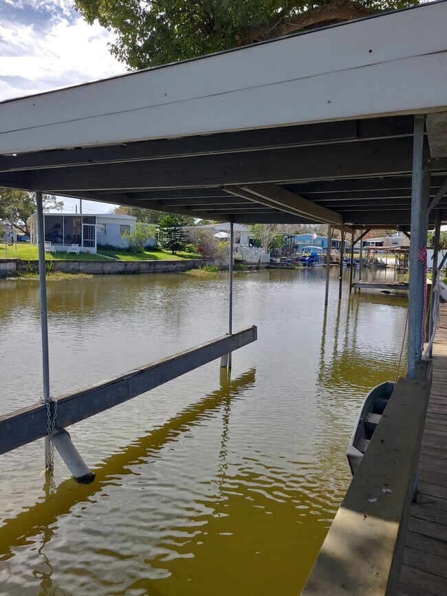 Building Photo - 55+ mobile home community. On canal to bea...
