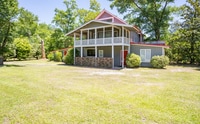 Building Photo - UNFURNISHED - 2 Bed 2 Bath + HUGE BONUS in a wooded oasis - NO HOA - off Middle Sound Loop
