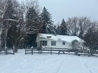 Building Photo - Bigfork Rodeo Farmhouse~ Fenced garden, greenhouse, garage, barn and shop!