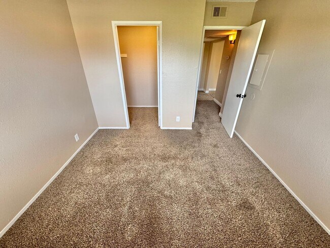 Building Photo - THIS SECOND-FLOOR DESERT SHORES CONDO OFFE...