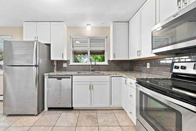 Building Photo - AVAILABLE NOW  Spacious 4-Bedroom Wheat Ridge Home with Finished Garden Level, Two-Car Garage & B...