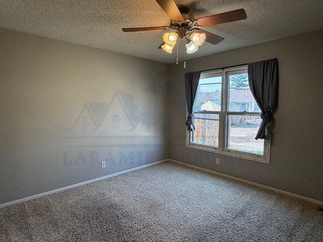 Building Photo - Single-Level 3-Bedroom Townhome with Primary Suite & Attached Garage