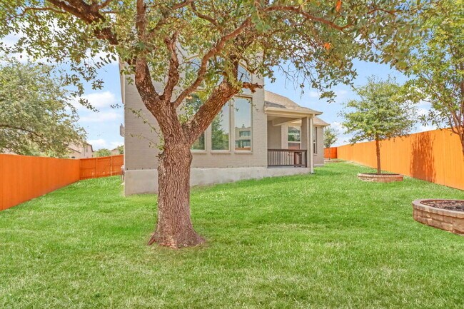 Building Photo - ASK ABOUT FREE APPLICATIONS THROUGH AUGUST!  "Spacious 4-Bedroom Sanctuary with Cozy Fireplace in...