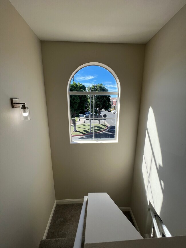 Stairwell with large window - 28 Santa Barbara Ct