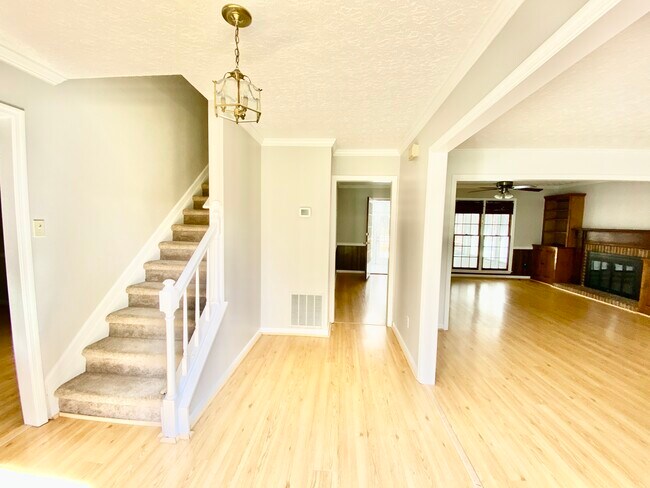 View form the front door to the stairs leading to the top floor where all the bedrooms are located. - 2160 Heritage Trace Ln