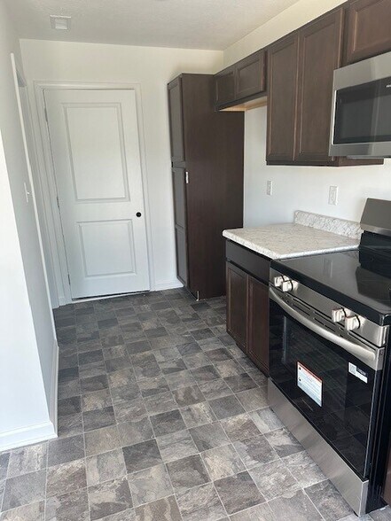 Kitchen - laundry room on left - 10810 Penwell Way