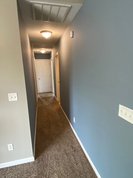 Hallway to bedrooms/bath w. linen closet - 12 Brookside Cir