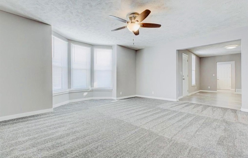 Living room flows into dining room/playroom - 3547 Avenue A