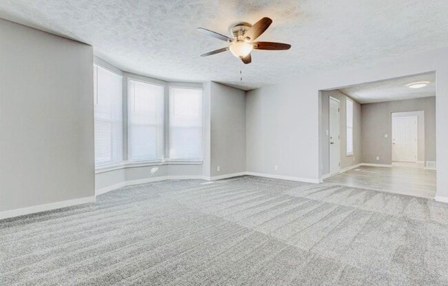 Living room flows into dining room/playroom - 3547 Avenue A