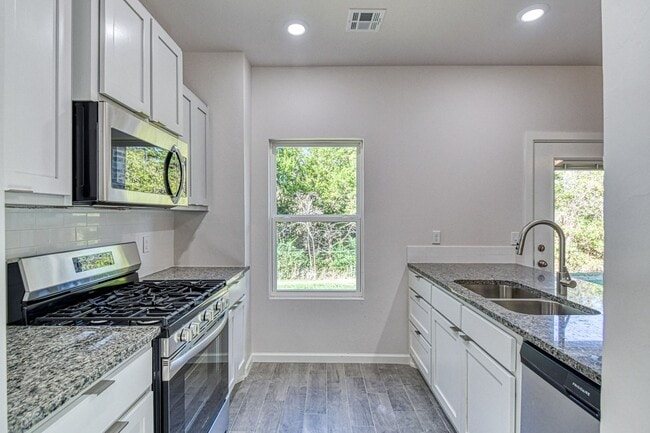 Building Photo - Brand New Construction! Lawn care included!