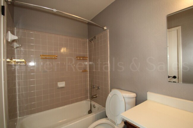 Building Photo - Spacious 4-Bedroom Home with Bonus Room, Large Yard & Solar Panels