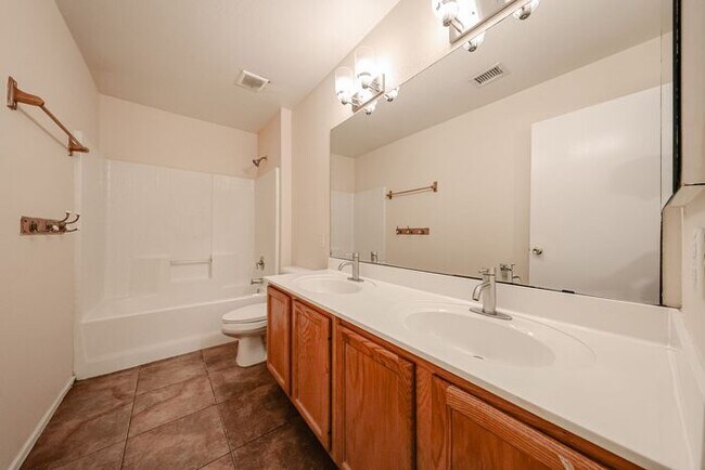 Building Photo - MOVE IN SPECIALS!! Lovely 4-bedroom, 2-bat...