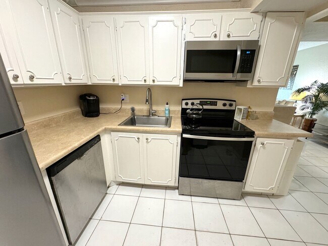 Building Photo - 5-Min Walk to FAU – Private Room in Furnished 2/2 Condo w/ Pool & Canal Views – $1550