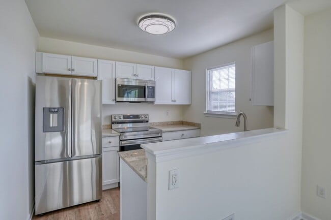 Building Photo - New, New, New - Spacious 3 Bedroom Townhouse with a Finished Basement !!