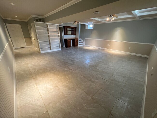 Huge family room includes built-in shelves and cabinetry - 11810 White Pine Dr