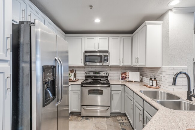 Thoughtful finishes including under cabinet lighting and subway tile backsplash - Alister Galleria