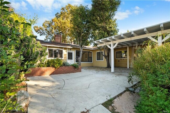 Building Photo - Tucked away behind gorgeous grand gates is this beautifully updated 3 bedroom 2 bath home