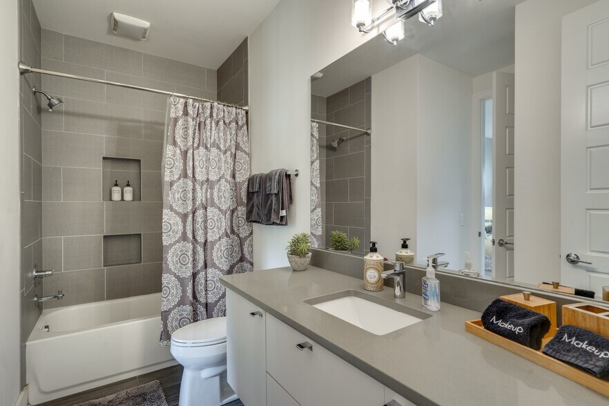 Ensuite Tub Shower Combo off the 1st Bedroom - 1910 11th Ave N