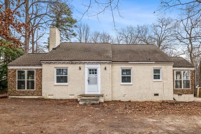 Building Photo - Brick home, Two Story, Hardwoods, DR, 2 Sun Rooms, FP, Carport!.