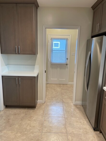 Kitchen into laundry room - 5631 E Vernon St