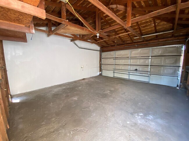 Building Photo - Hard to Find 1 BD 1 BA House with a 2 car garage and it's own yard.