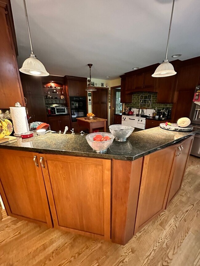 Building Photo - Dream Home in Highland, Michigan: Your Private Oasis on 5 Wooded Acres