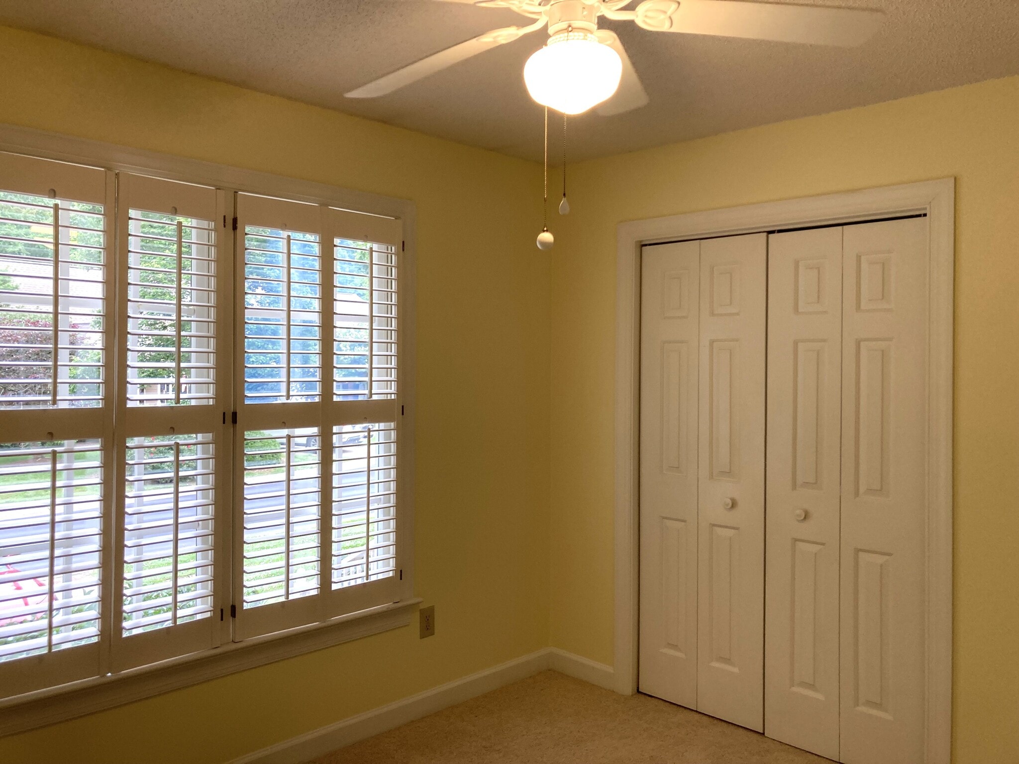 Bedroom features plantation shutters and a spacious closet - 1243 Cranebridge Pl