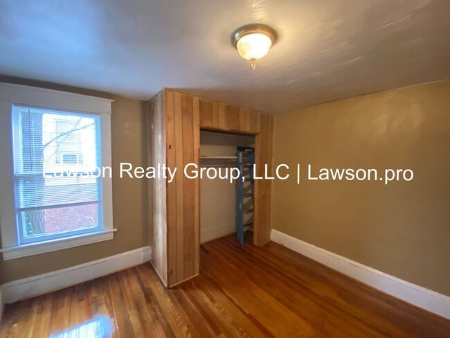 Building Photo - Updated Three Bedroom with Flat Yard