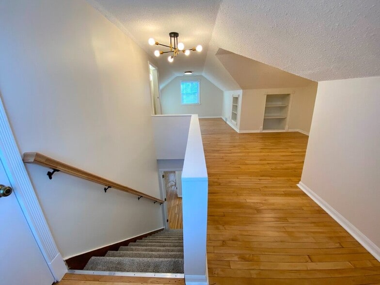 Primary Suite - Expansive upper-level suite with refinished maple floors - 710 Sheridan Avenue North
