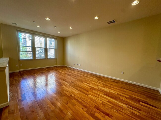 Building Photo - TOWNHOME WITH THOUGHTFUL UPGRADES | CALM SETTING