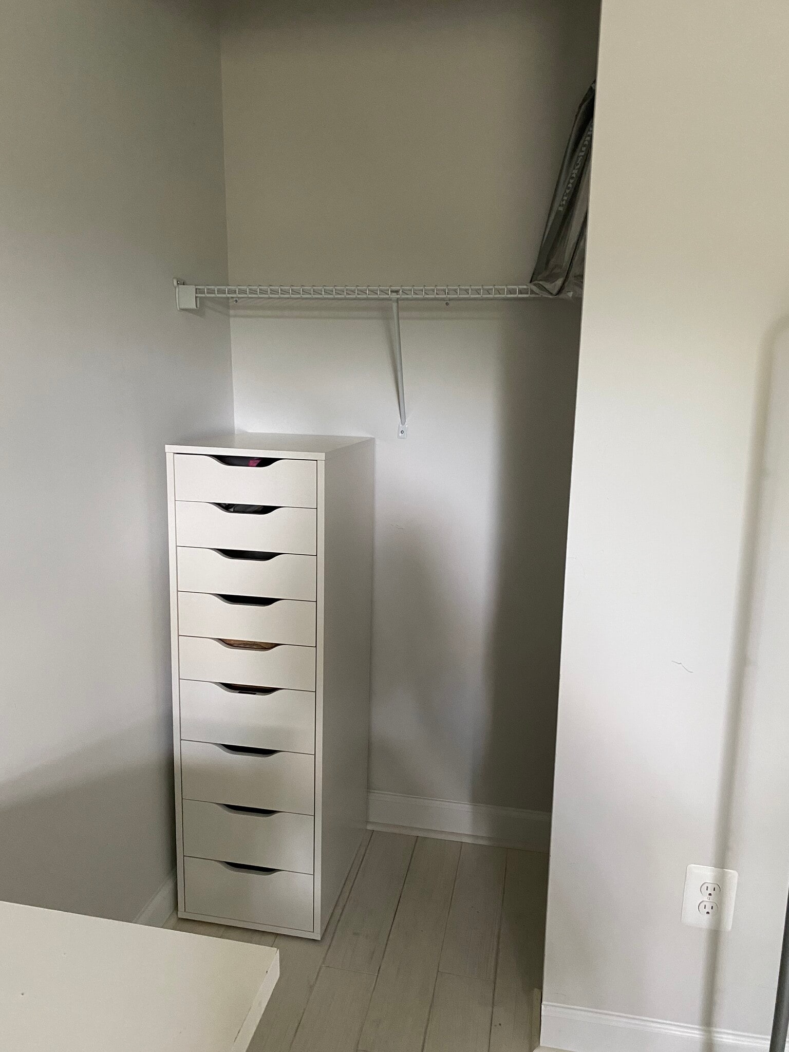 Closet with top shelf, room to hang clothes, and chest of drawers. - 7922 Fitzroy St