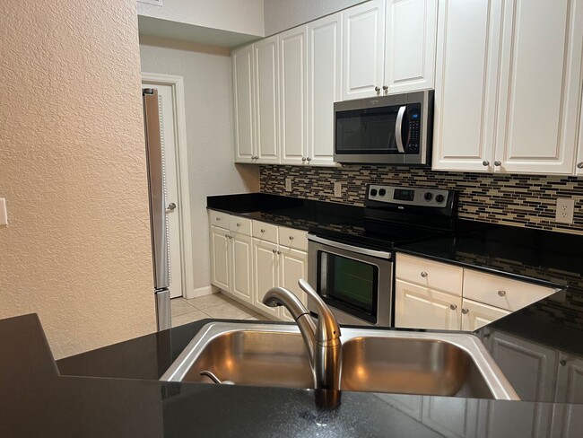 Building Photo - Spacious 3BR/2BA Gated Condo with Resort-Style Amenities!