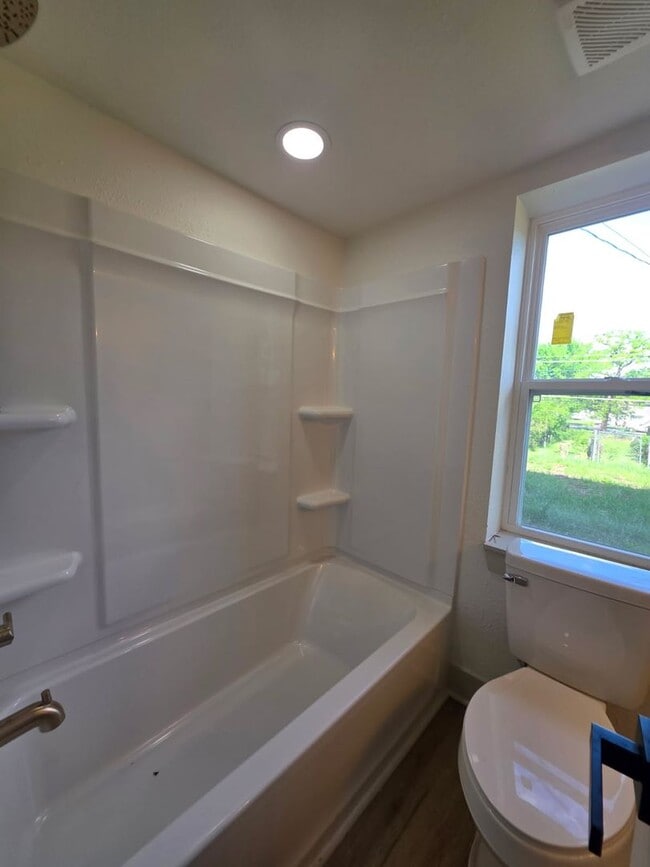 Building Photo - Studio Apartment with bathroom, kitchen & utility area on the lower level of property.