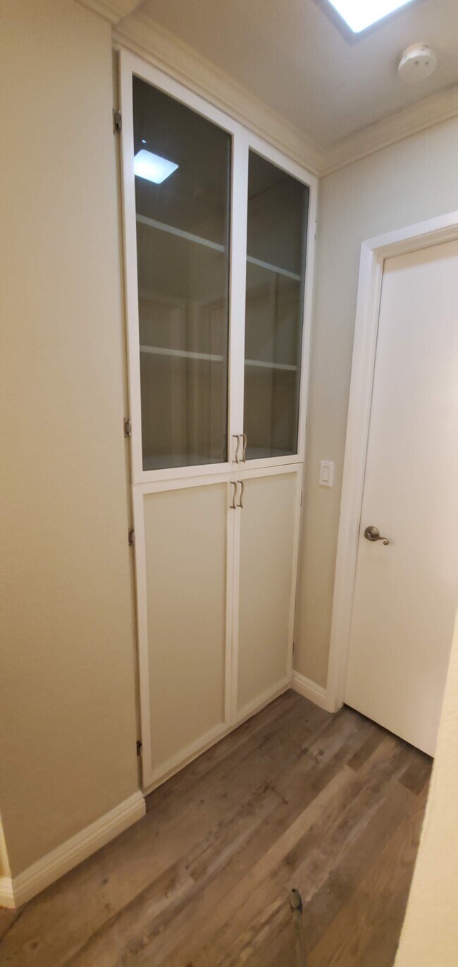 hallway to bedroom and bathroom with storage - 2852 C St
