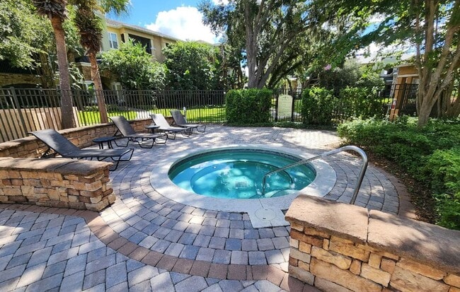 Building Photo - Elegant 1-Bedroom Condo with Lakeside Views in Resort-Style Community